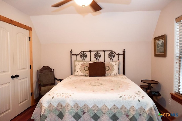 211 Cambridge Dr, New Braunfels, TX 78132 - bedroom featuring a closet, a ceiling fan, dark wood-style flooring, and lofted ceiling