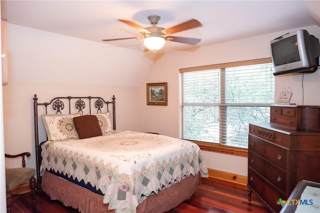 211 Cambridge Dr, New Braunfels, TX 78132 - bedroom featuring lofted ceiling, multiple windows, wood finished floors, and baseboards