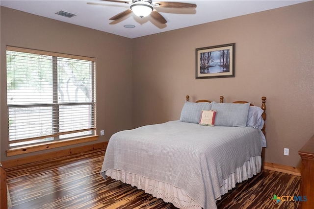 211 Cambridge Dr, New Braunfels, TX 78132 - bedroom with baseboards, visible vents, wood finished floors, and ceiling fan