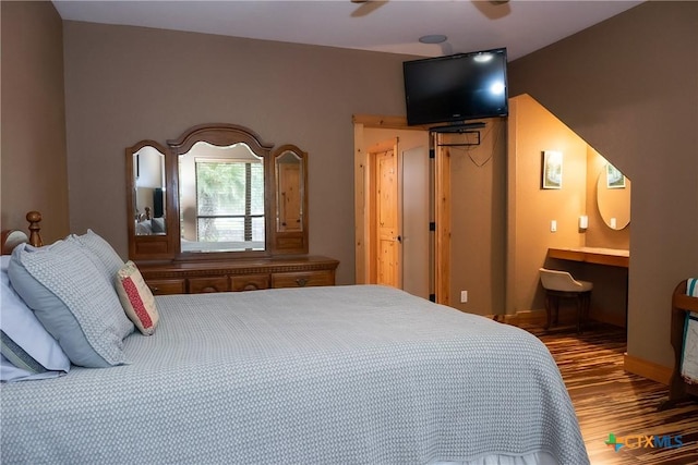 211 Cambridge Dr, New Braunfels, TX 78132 - bedroom with baseboards, wood finished floors, and ensuite bath