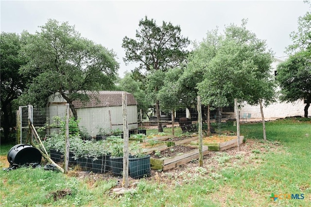 211 Cambridge Dr, New Braunfels, TX 78132 - view of yard with an outbuilding, a vegetable garden, and a storage shed