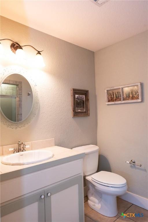 211 Cambridge Dr, New Braunfels, TX 78132 - bathroom featuring toilet, tile patterned flooring, and vanity