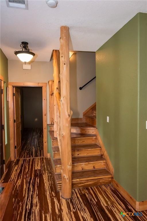 211 Cambridge Dr, New Braunfels, TX 78132 - stairway featuring wood finished floors, visible vents, and baseboards
