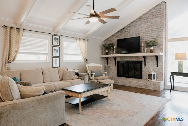 living room featuring a fireplace, ceiling fan, lofted ceiling with beams, and wood finished floors