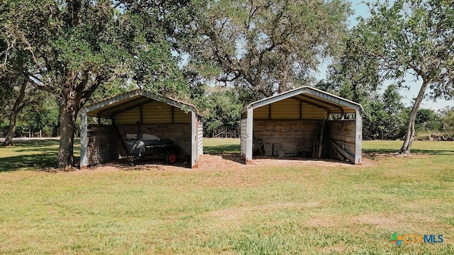 view of outbuilding with a carport