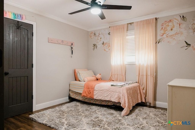 bedroom featuring a ceiling fan, wood finished floors, baseboards, and ornamental molding