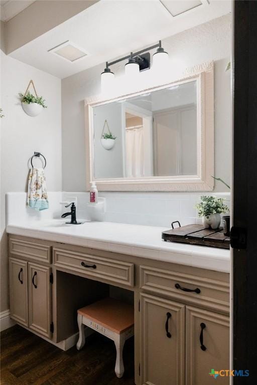 full bath with wood finished floors and vanity