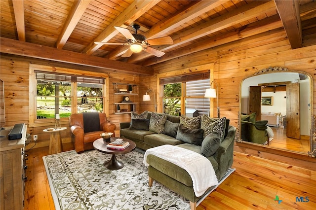 332 Westin Hls, New Braunfels, TX 78132 - living room with wood walls, wood ceiling with exposed beams, light wood-style flooring, and a ceiling fan