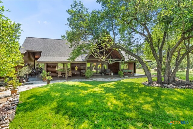 332 Westin Hls, New Braunfels, TX 78132 - rear view of property featuring a yard, a shingled roof, and log exterior