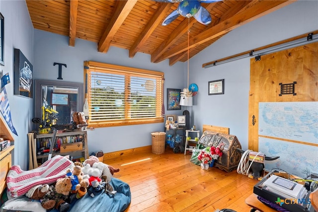 bedroom featuring lofted ceiling with beams, wood-type flooring, ceiling fan, and wooden ceiling