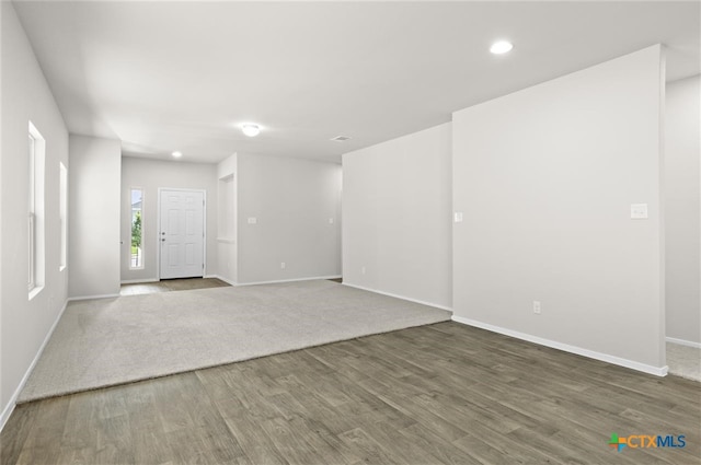 spare room featuring dark hardwood / wood-style floors