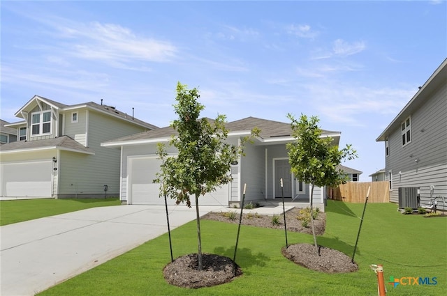 view of front of home with a front yard and central AC unit