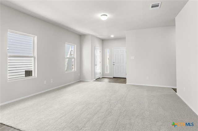 empty room with carpet flooring