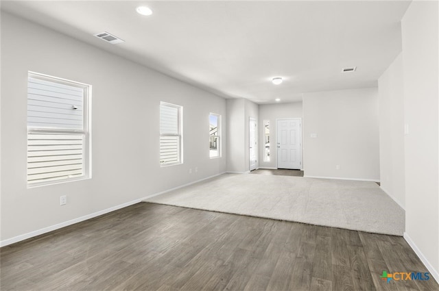 unfurnished room featuring dark hardwood / wood-style flooring