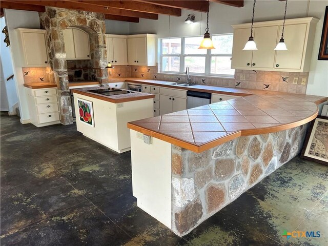 184 Guadalupe Hills Ln, Seguin, TX 78155 - kitchen featuring beamed ceiling, tasteful backsplash, dishwasher, tile countertops, and a kitchen island
