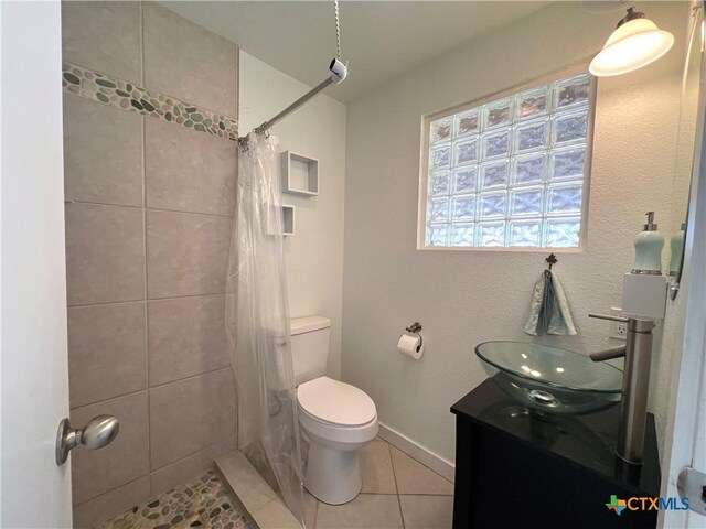184 Guadalupe Hills Ln, Seguin, TX 78155 - bathroom with tile patterned floors, vanity, and tiled shower