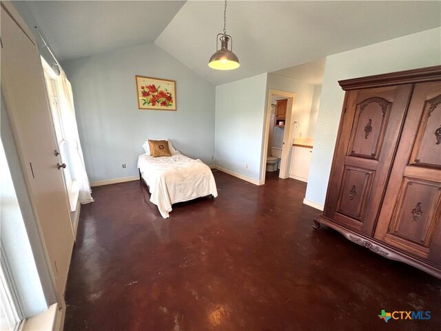 184 Guadalupe Hills Ln, Seguin, TX 78155 - bedroom featuring finished concrete floors, vaulted ceiling, and connected bathroom