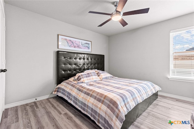 bedroom featuring ceiling fan and light wood-type flooring