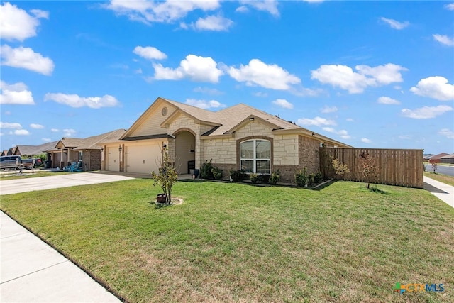 ranch-style house featuring a garage and a front yard