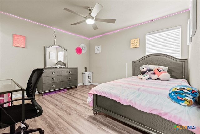 bedroom with ceiling fan and light wood-type flooring