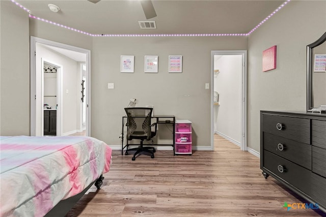 bedroom featuring light hardwood / wood-style floors and ceiling fan