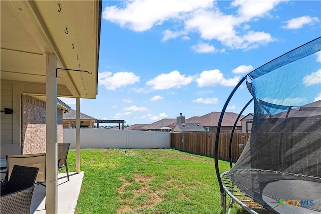 view of yard with a trampoline