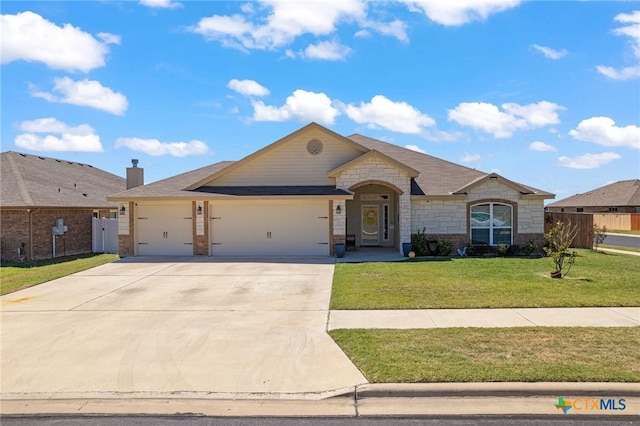 single story home featuring a front yard and a garage