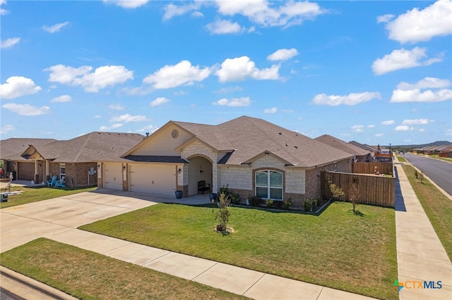 ranch-style house with a front yard and a garage