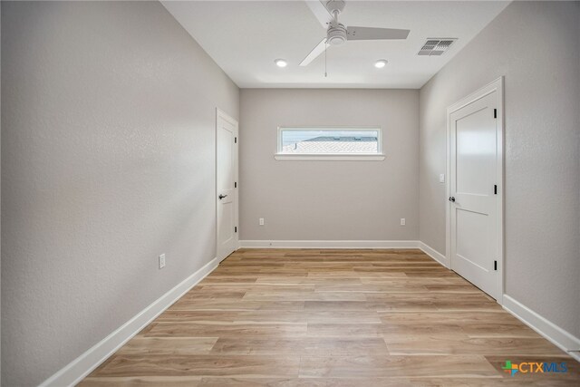 unfurnished room featuring ceiling fan and light hardwood / wood-style flooring