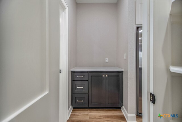 bathroom with hardwood / wood-style floors