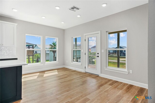 doorway to outside featuring light wood-type flooring