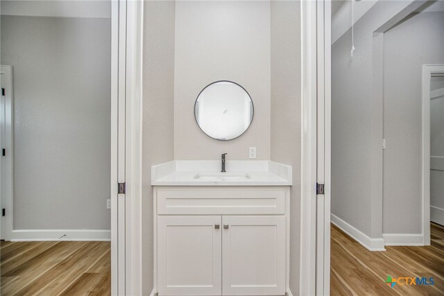 bathroom featuring vanity and hardwood / wood-style flooring