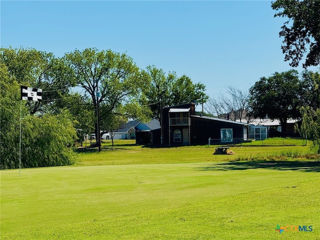 view of community featuring a lawn