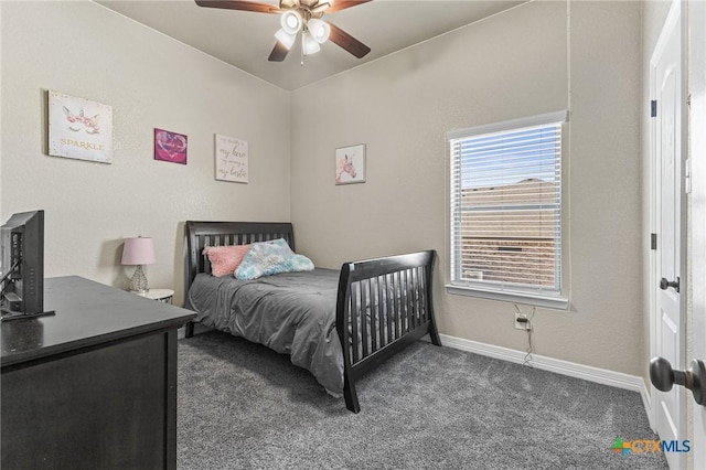 carpeted bedroom with ceiling fan and baseboards