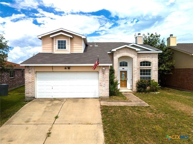 view of front of property with a front lawn and a garage