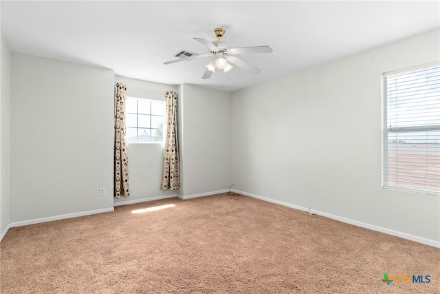 carpeted empty room with ceiling fan