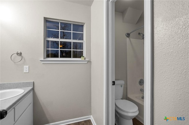 full bathroom with vanity, toilet, tub / shower combination, and wood-type flooring