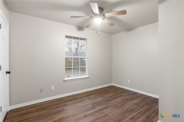 spare room featuring ceiling fan and dark hardwood / wood-style flooring