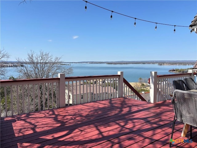 wooden terrace with a water view