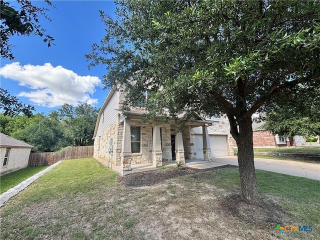 4208 Brookhaven Dr, Temple, TX 76504 - obstructed view of property with stone siding, driveway, an attached garage, and a porch