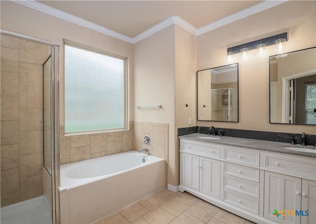 4208 Brookhaven Dr, Temple, TX 76504 - full bathroom featuring a garden tub, double vanity, a stall shower, tile patterned flooring, and ornamental molding
