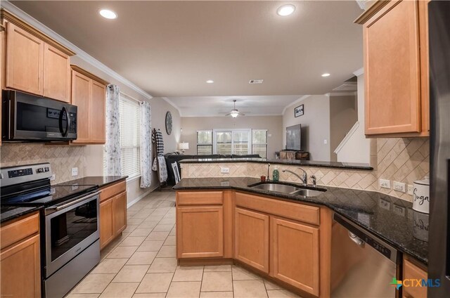 4208 Brookhaven Dr, Temple, TX 76504 - kitchen with stainless steel appliances, light tile patterned floors, healthy amount of natural light, dark stone counters, and recessed lighting