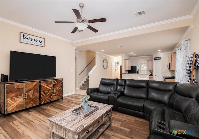 4208 Brookhaven Dr, Temple, TX 76504 - living room with ornamental molding, a ceiling fan, light wood finished floors, stairs, and recessed lighting