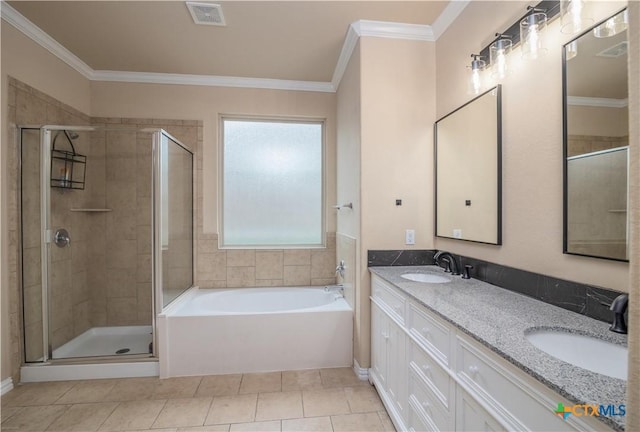 4208 Brookhaven Dr, Temple, TX 76504 - bathroom featuring a shower stall, a garden tub, double vanity, ornamental molding, and tile patterned flooring