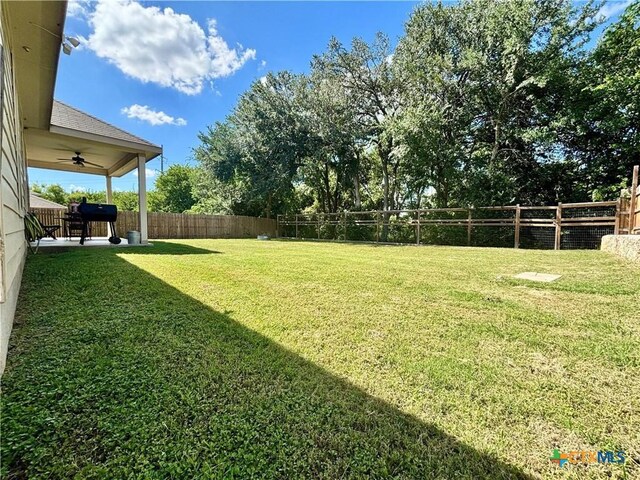 4208 Brookhaven Dr, Temple, TX 76504 - fenced backyard with ceiling fan