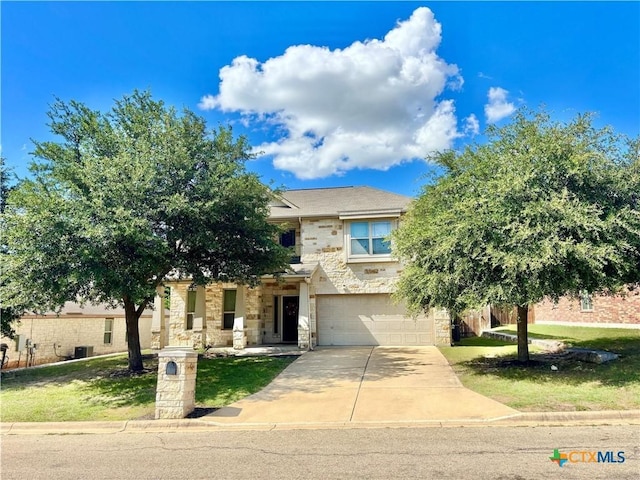 4208 Brookhaven Dr, Temple, TX 76504 - view of front of property with concrete driveway, stone siding, an attached garage, and a front lawn