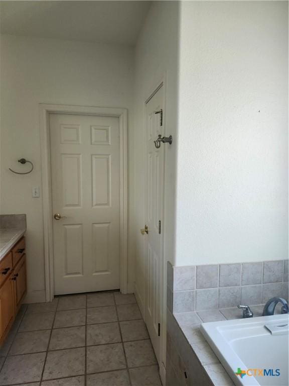 56 Post Oak Jct, Inez, TX 77968 - full bath featuring tile patterned flooring, a tub, and vanity