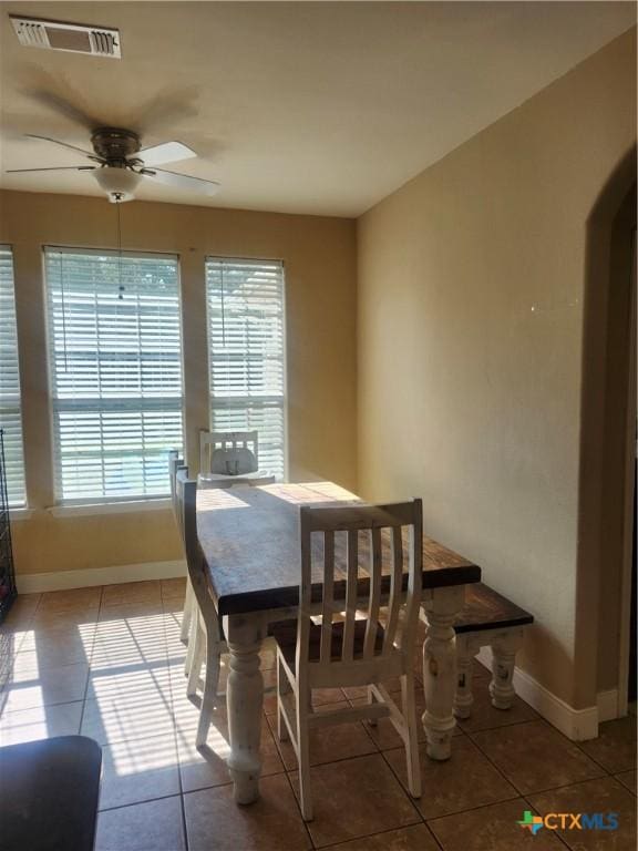 56 Post Oak Jct, Inez, TX 77968 - tiled dining room with plenty of natural light, ceiling fan, and baseboards
