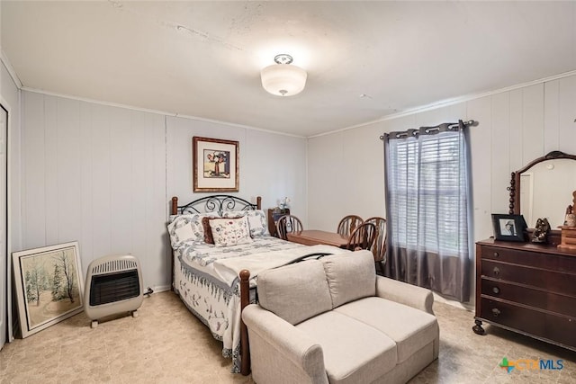 1309 Blackjack St, Lockhart, TX 78644 - bedroom with heating unit, ornamental molding, and light carpet
