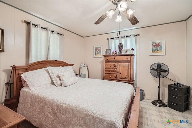 1309 Blackjack St, Lockhart, TX 78644 - bedroom with light flooring, a ceiling fan, and baseboards